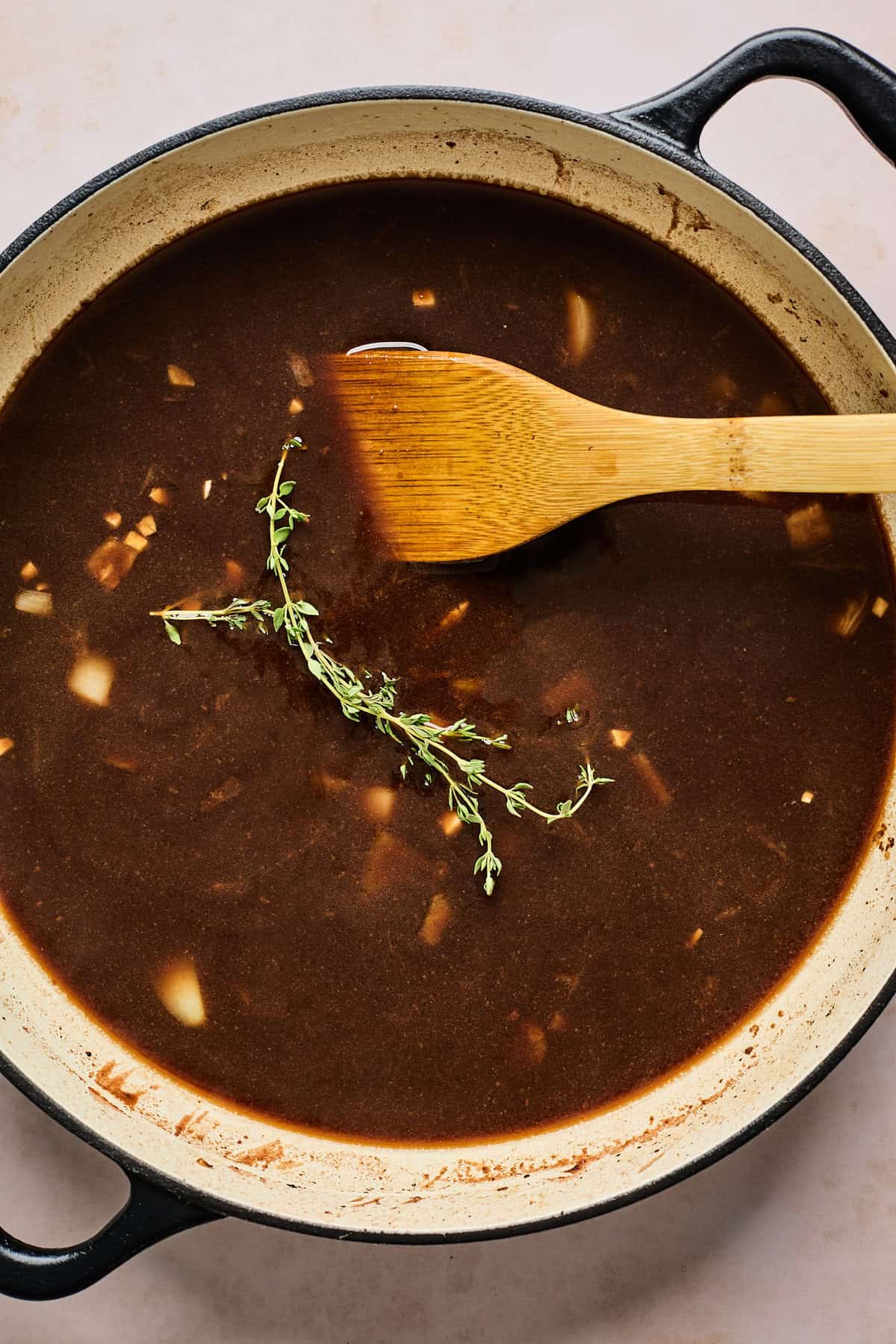 Gravy being stirred in a large pot