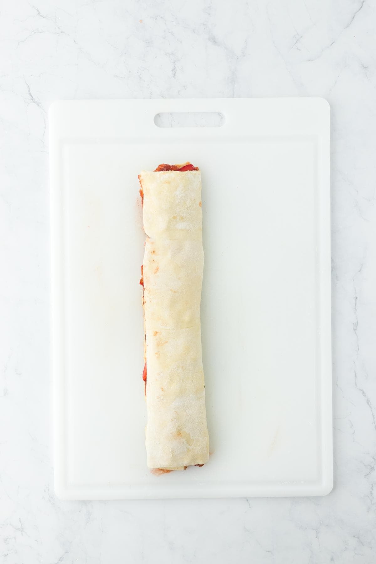 Dough tightly rolled into a log shape