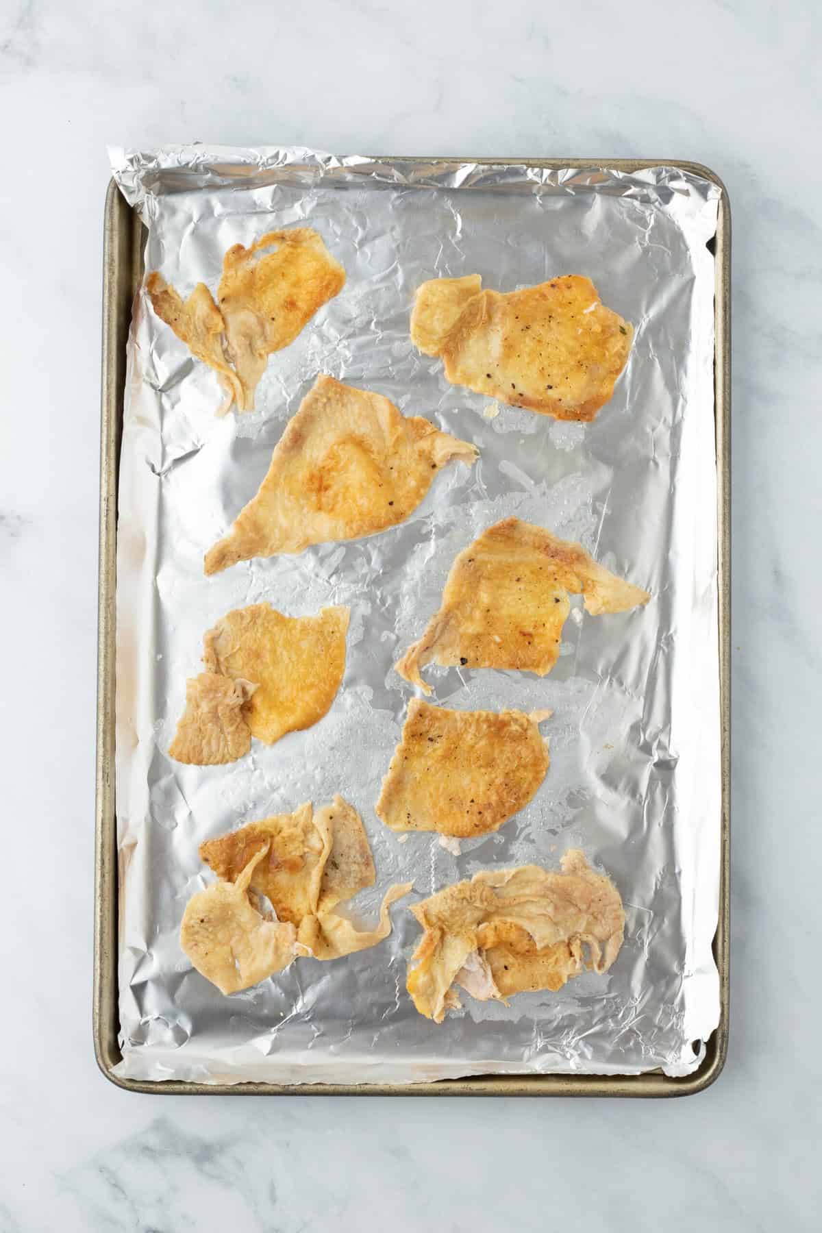 Chicken skin on foil baked