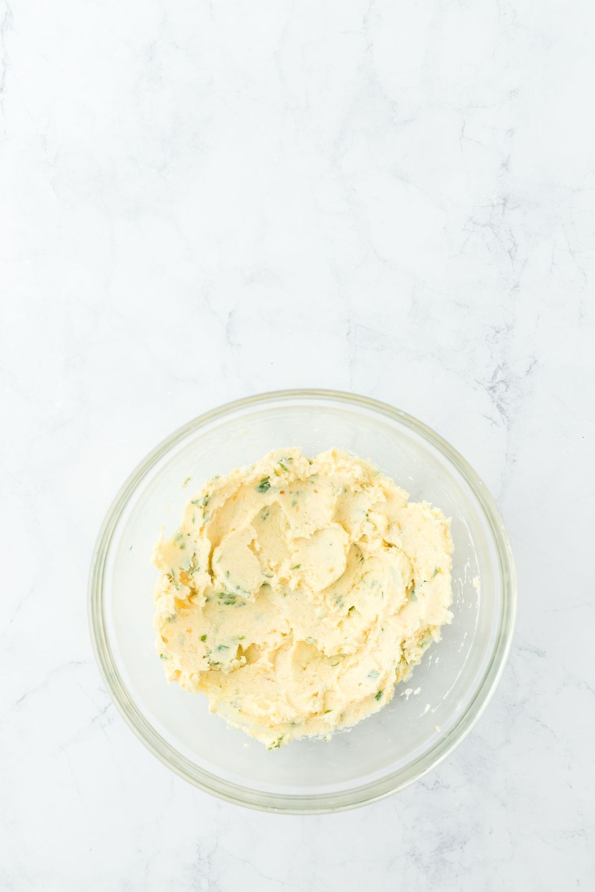 A bowl of smooth, well-mixed garlic butter