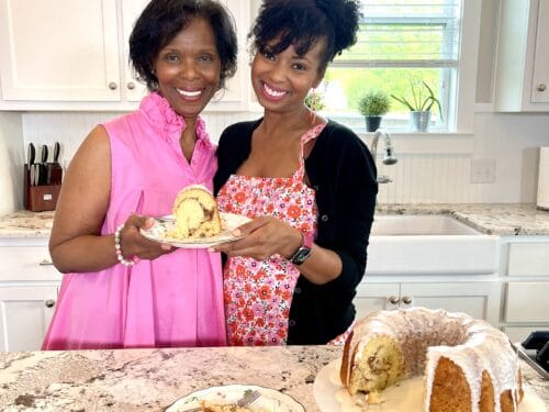 Jocelyn Delk Adams and mother holding slice of cake