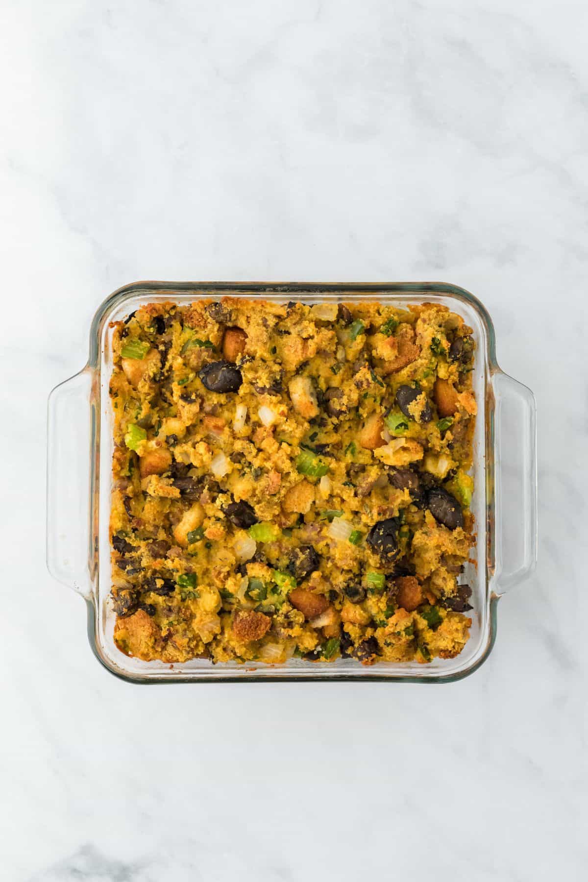 Oyster dressing in a glass baking dish, freshly baked