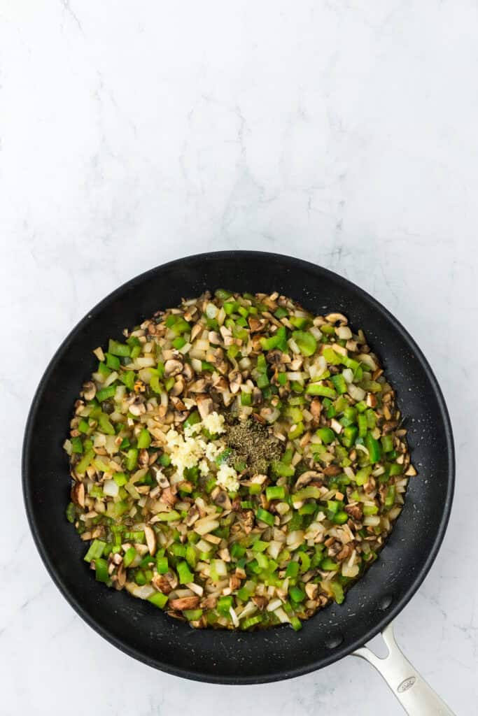 softened mushrooms, onions, celery, green bell peppers in a skillet