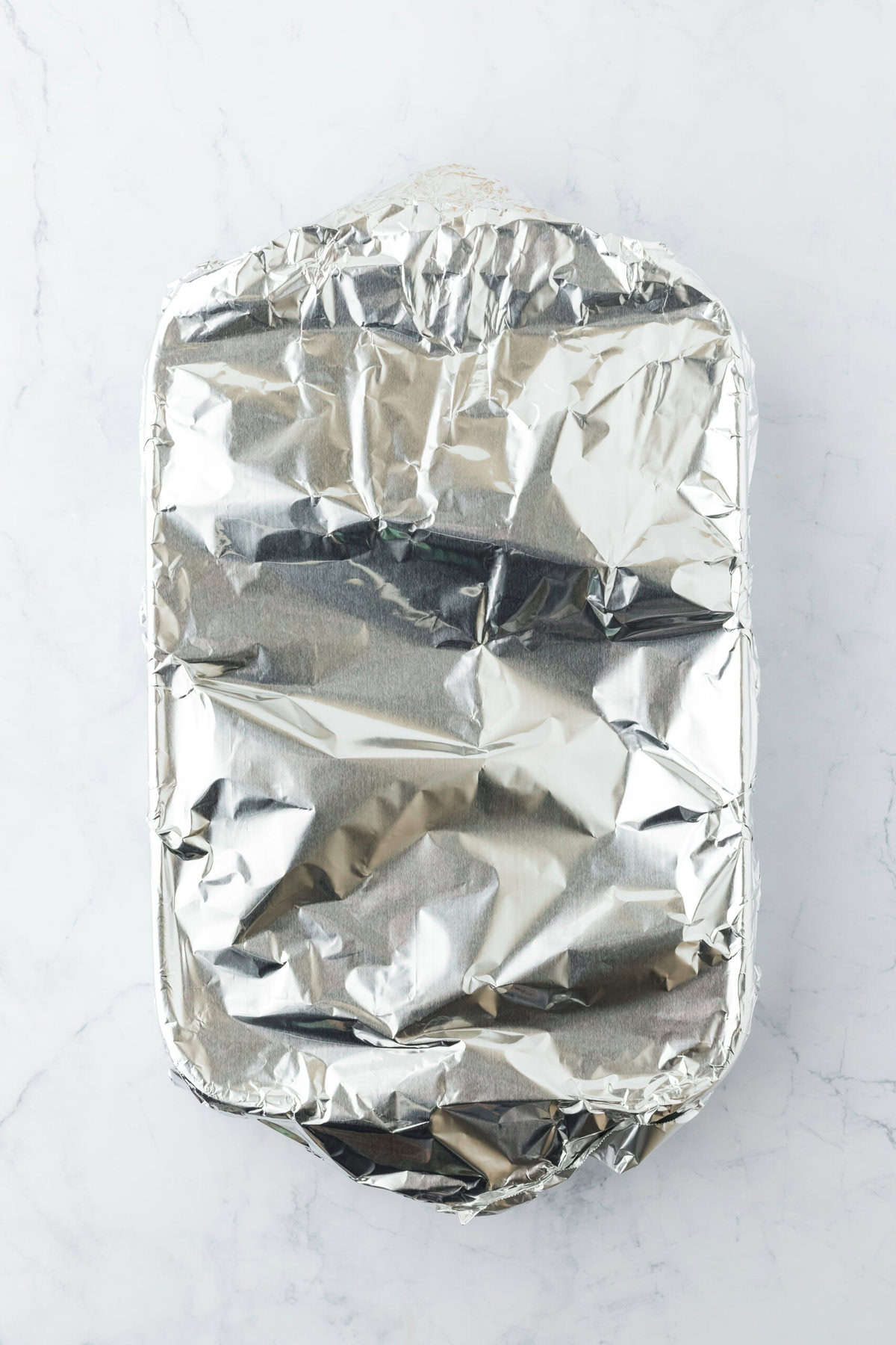 a 9x13 casserole dish covered with tin foil