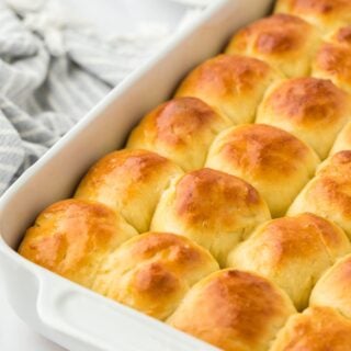 A baking dish filled with perfectly golden yeast rolls