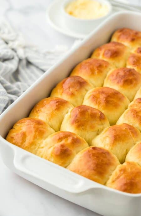 A baking dish filled with perfectly golden yeast rolls