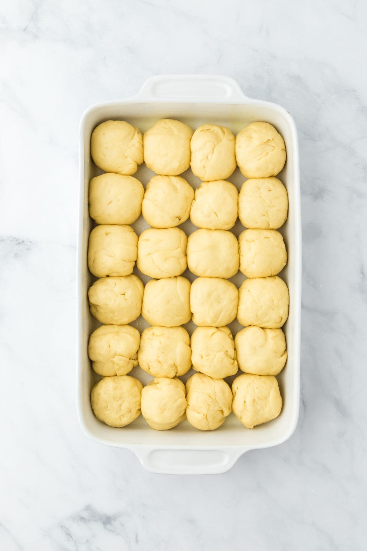 Dough pieces that have risen and filled the baking dish