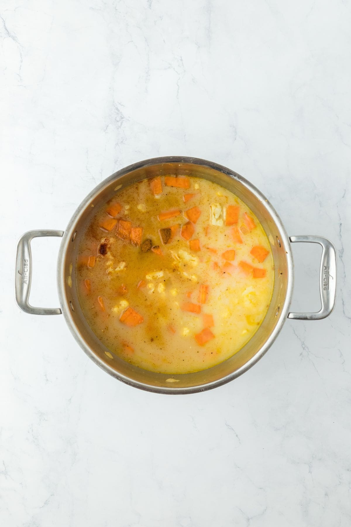 The same pot of soup with the vegetables now tender and starting to break down in the broth