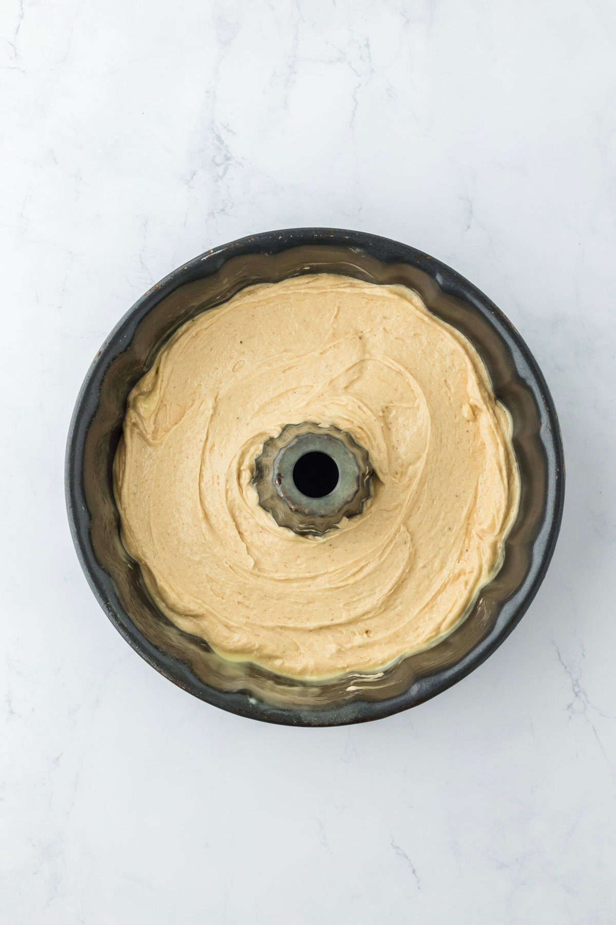 Biscoff cake in a bundt pan, not yet baked