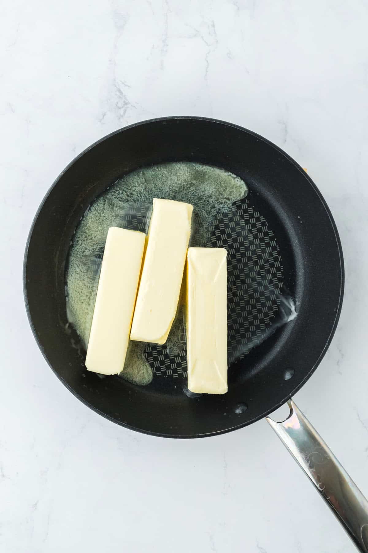 3 sticks of butter melting to make brown butter