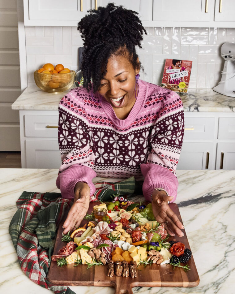 Jocelyn Delk Adams with her finished Christmas Tree charcuterie board ready to serve