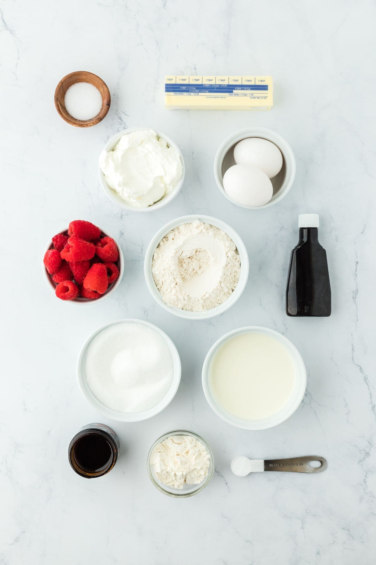 Overhead shot of ingredients for making creme brulee pound cake on a white surface before mixing