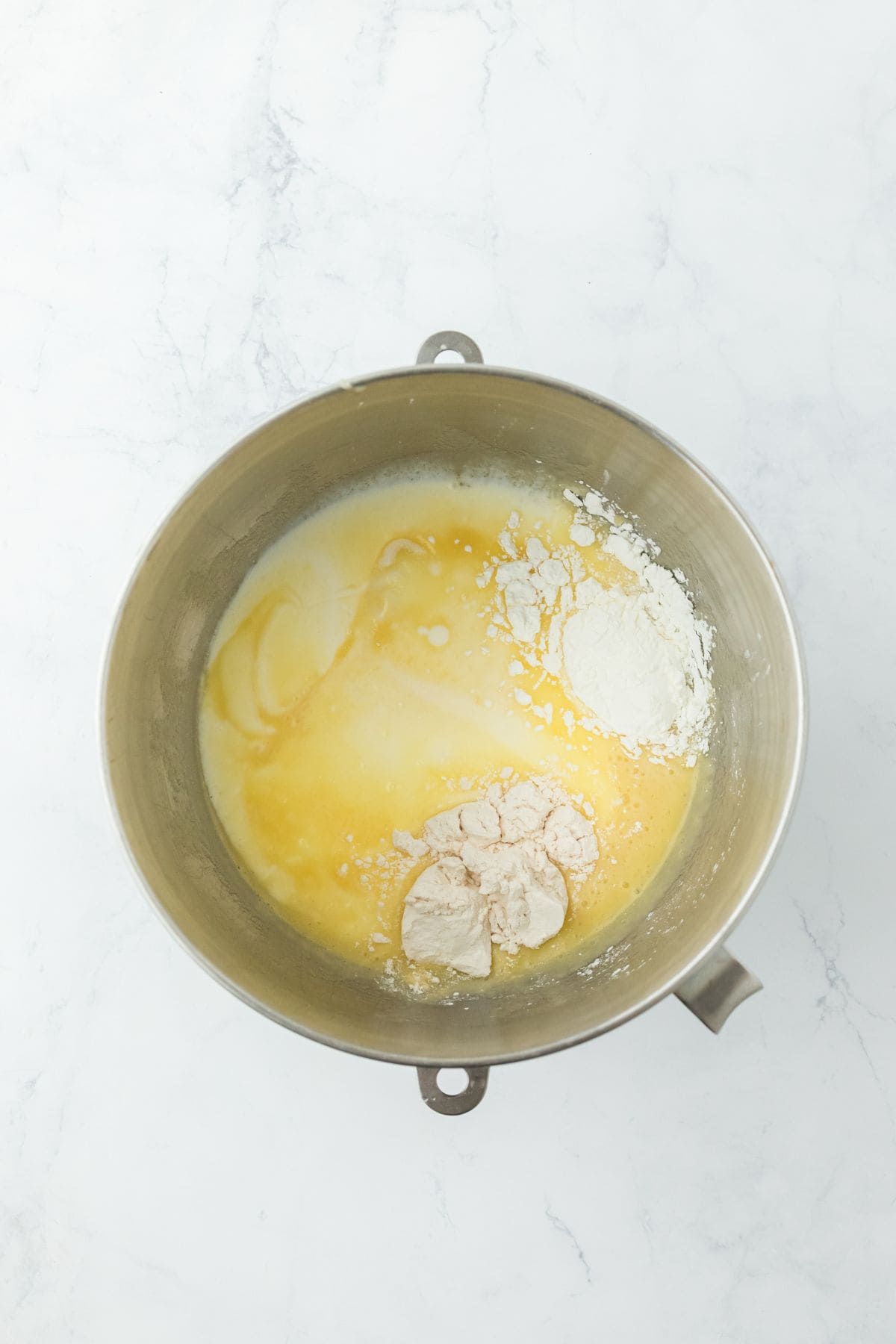 Flour and milk being added to the mixture