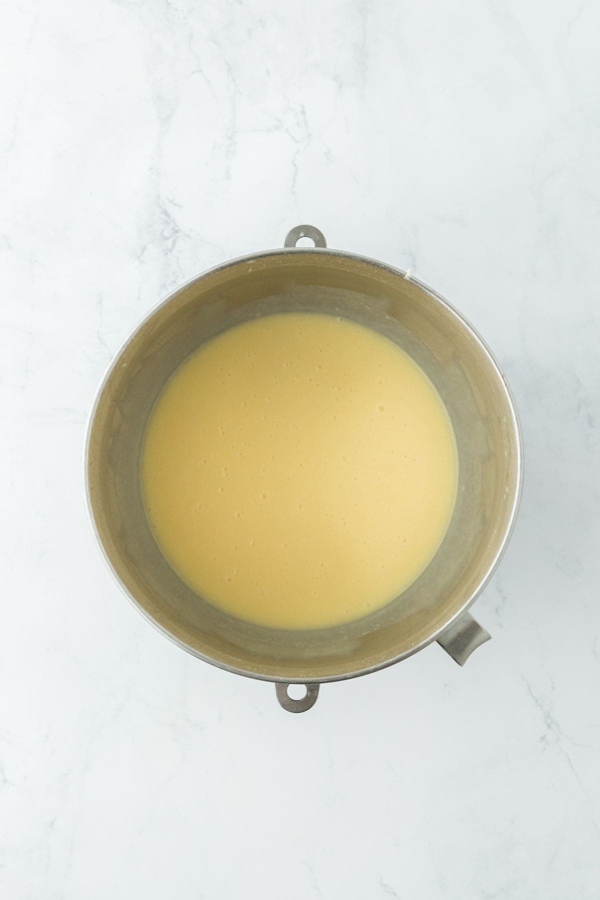 A mixing bowl containing a smooth, creamy buttermilk filling