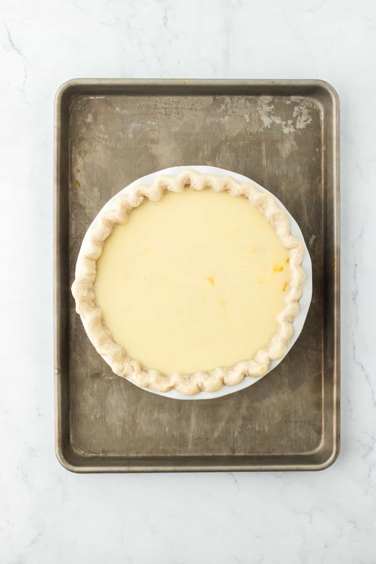 A second layer of buttermilk filling on top of the sweet potato filling, ready to bake