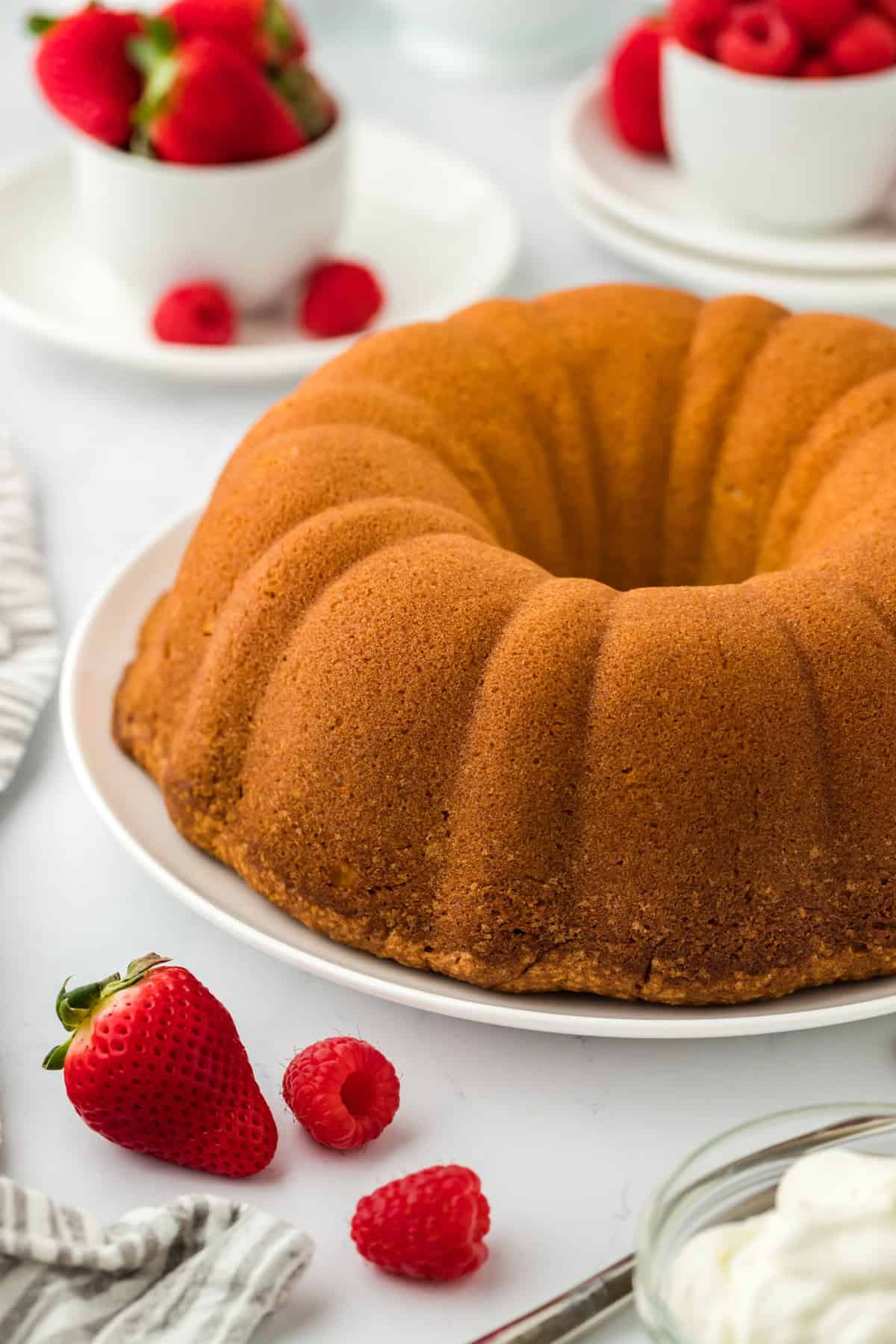 Flipped out pound cake on a white plate before serving