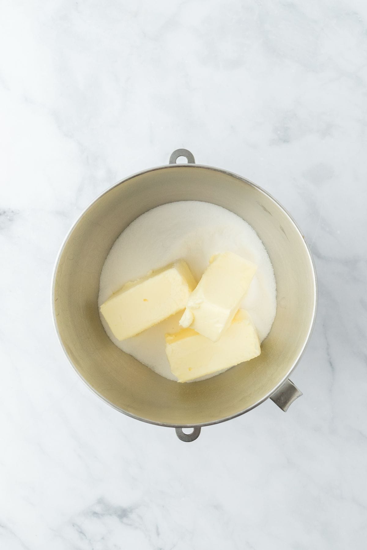 A mixing bowl with butter and sugar ready for creaming