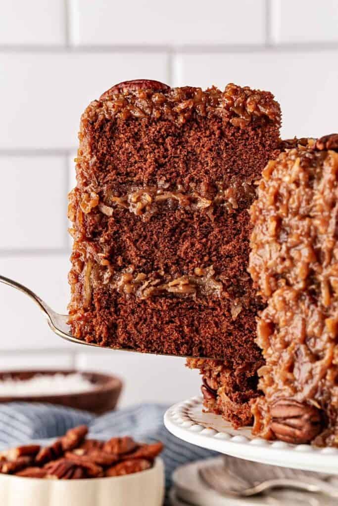 A slice of German cake being removed from cake
