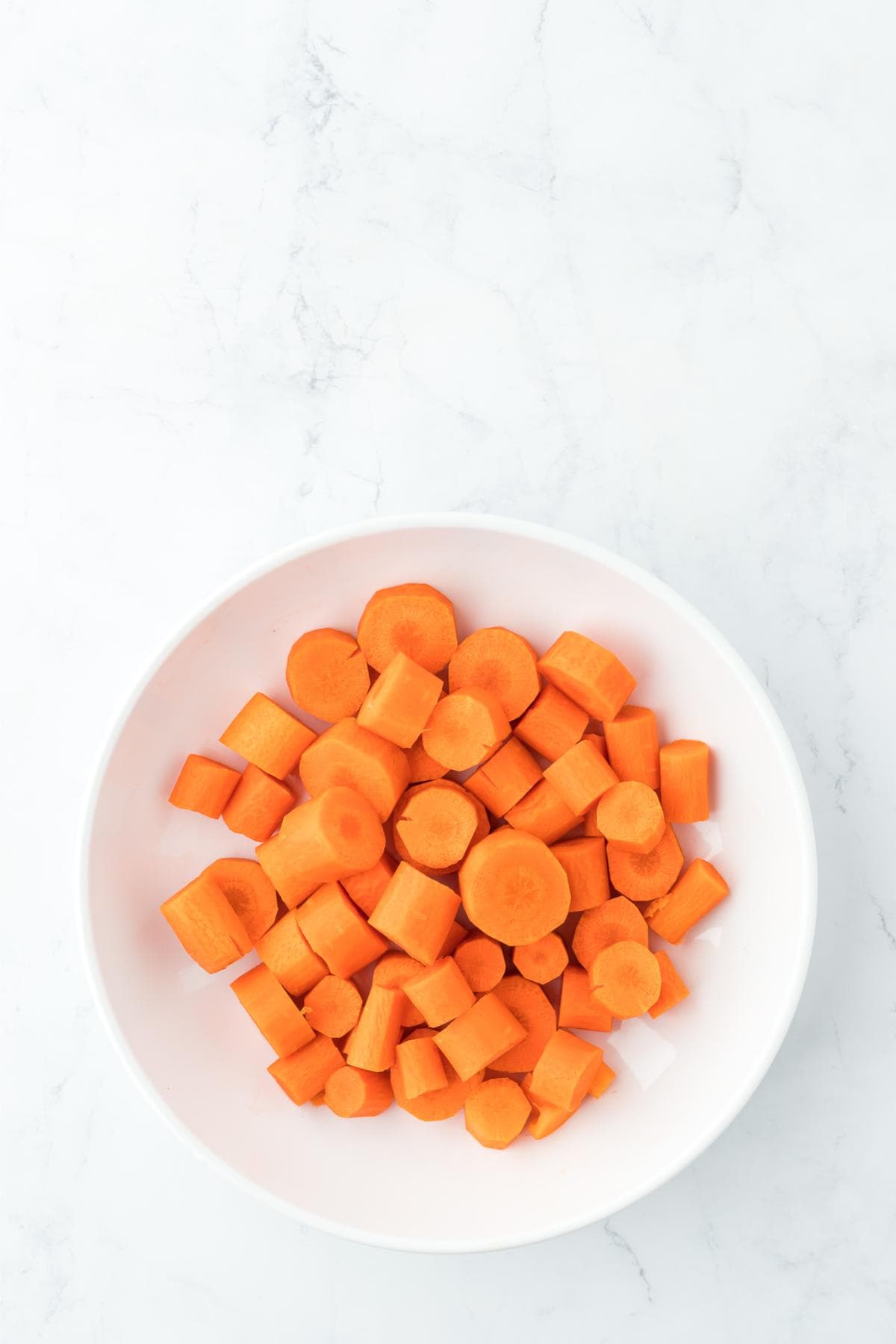 Peeled and sliced carrots in a bowl