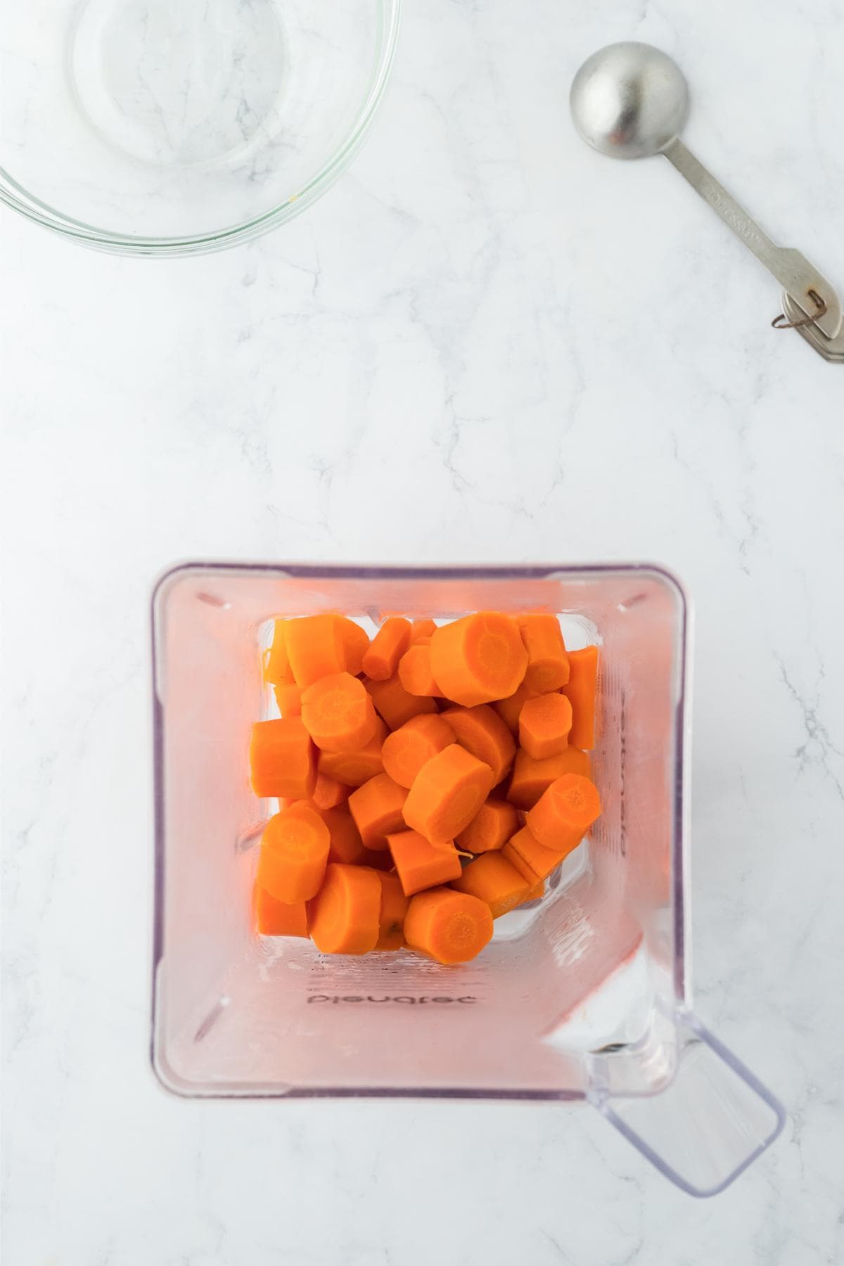 Carrot slices added to a blender