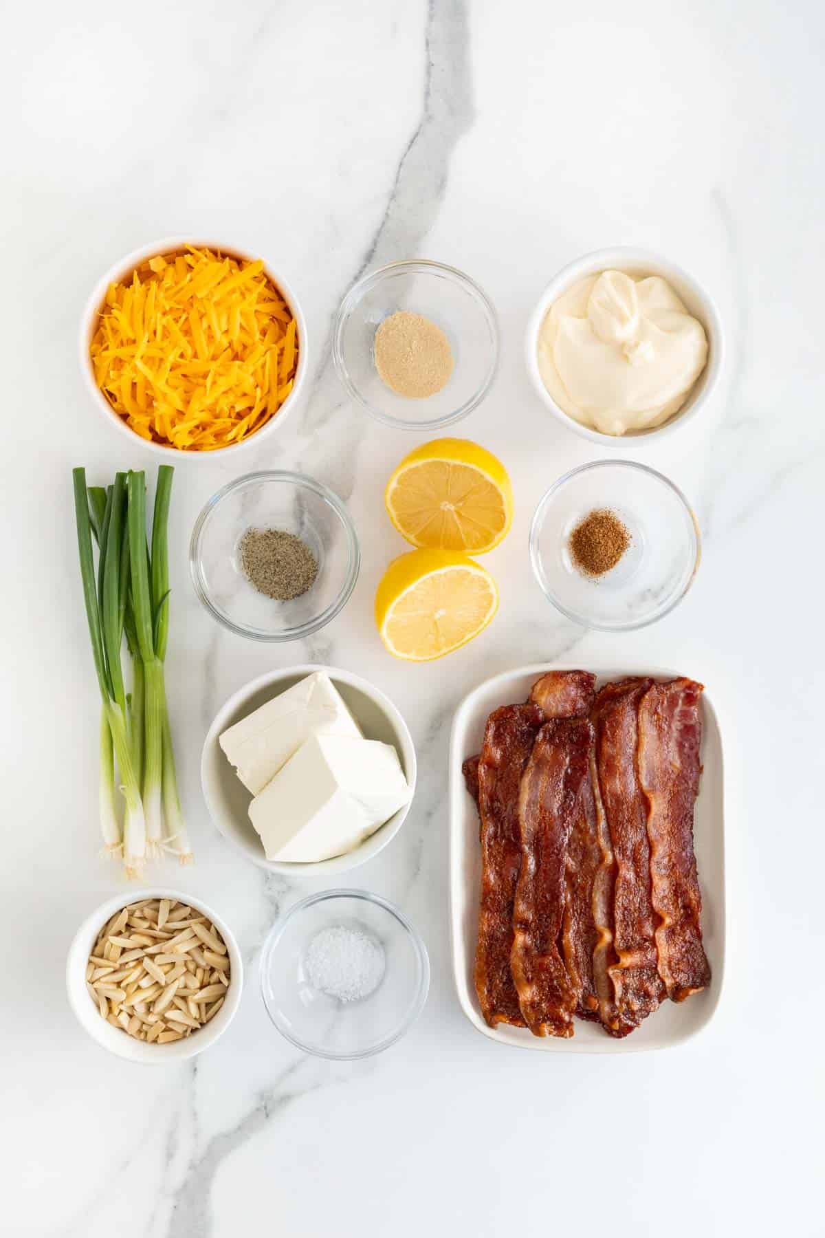 Overhead shot of ingredients for making million dollar dip on a marble surface before mixing