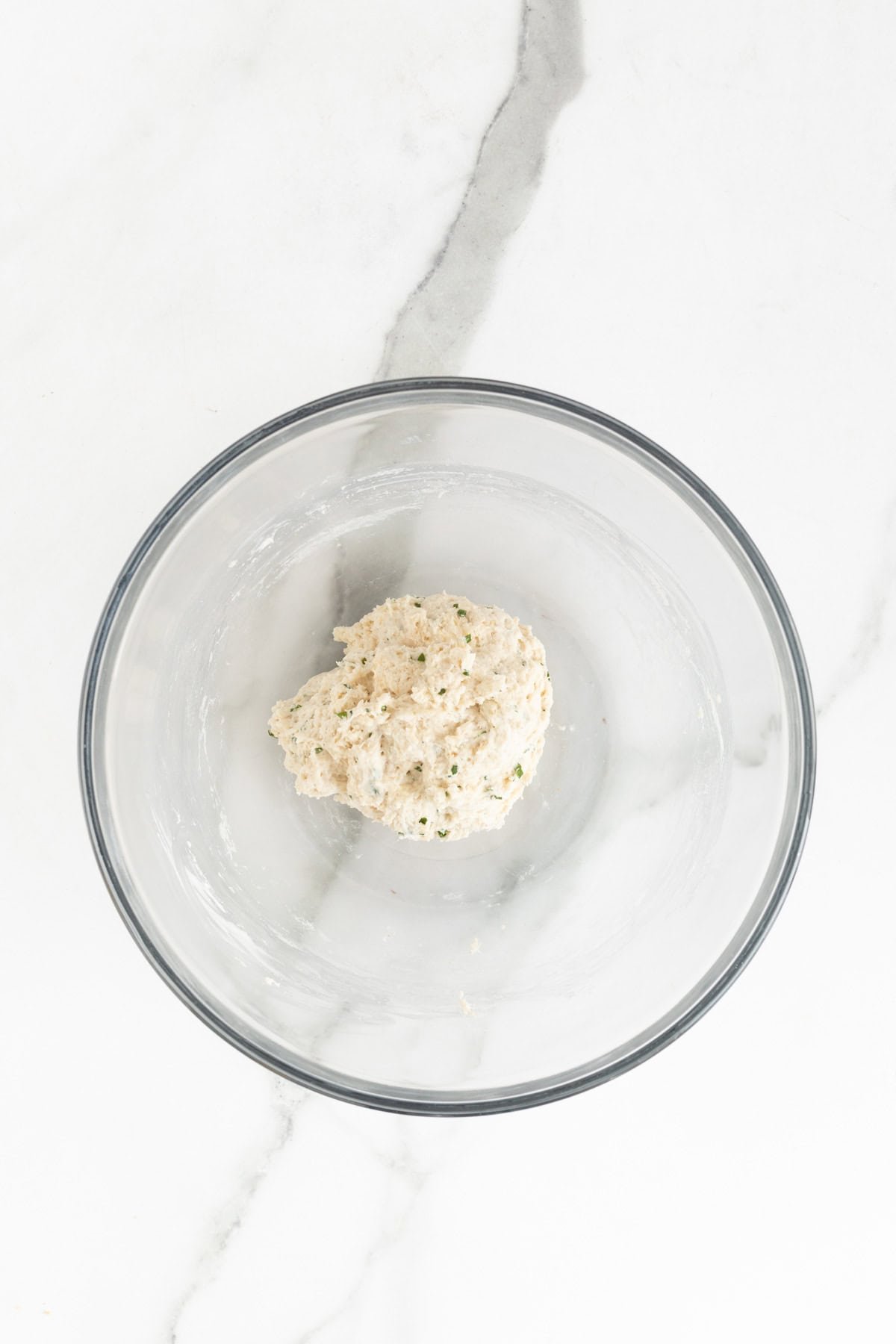 The finished dumpling dough after being mixed, sitting in a bowl