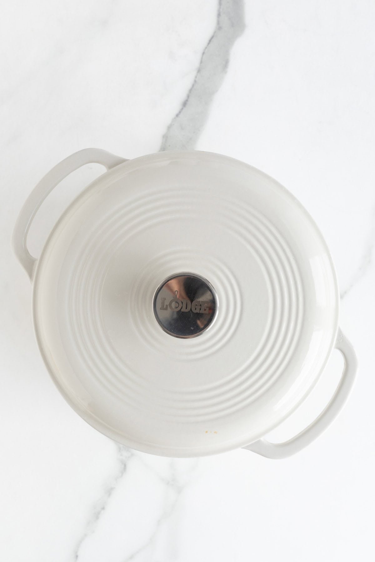 A white pot with a lid