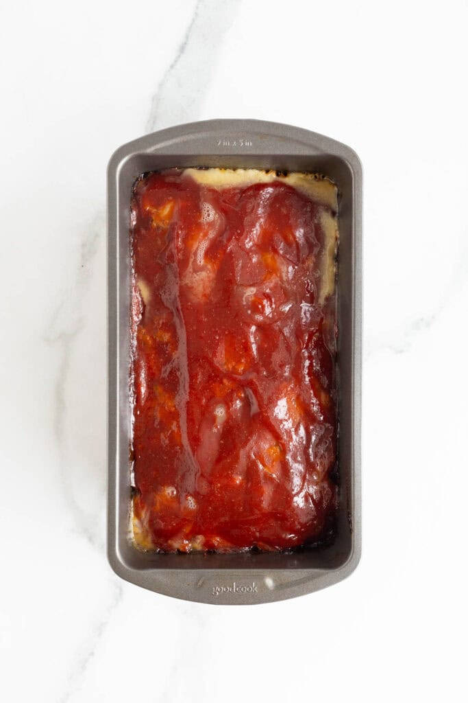 Fully baked turkey meatloaf fresh out of the oven with a shiny, thick glaze on top