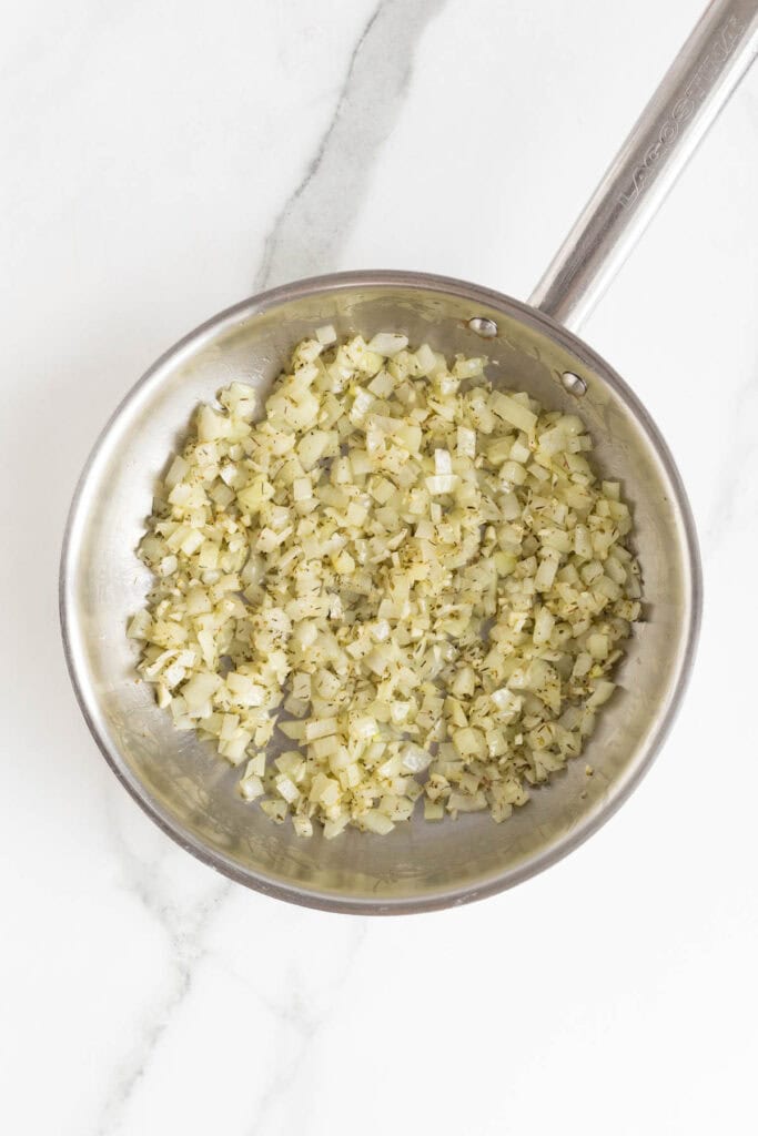 Onion and herbs fully cooked and blended together in the skillet