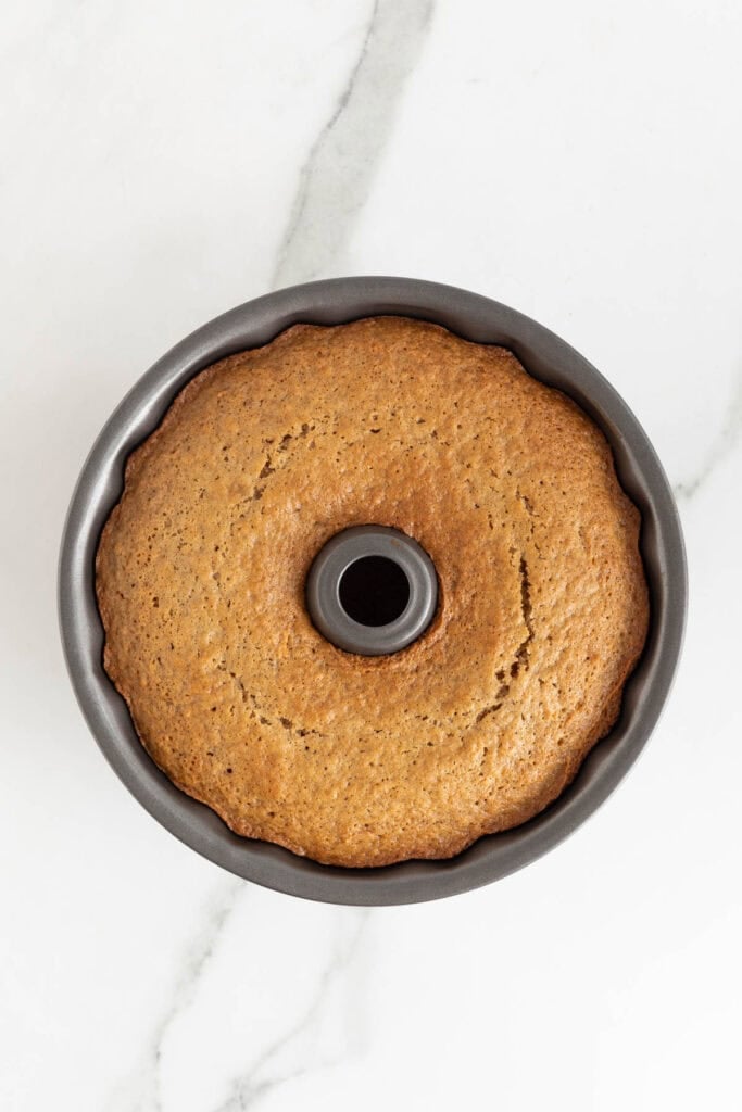 Baked carrot Bundt cake still in the pan, golden brown on top