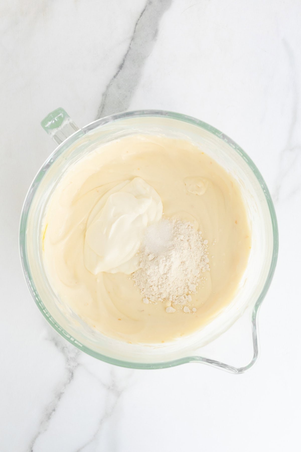Sour cream, salt and flour added to the smooth cheesecake batter