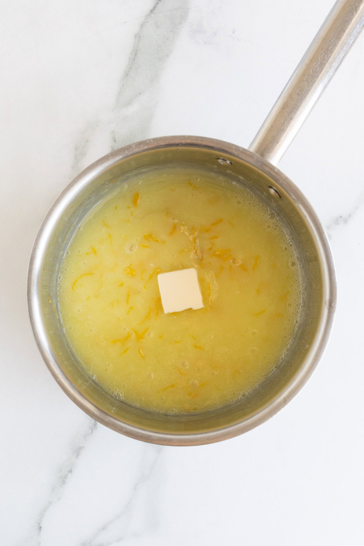 Butter added to the lemon curd mixture in the saucepan