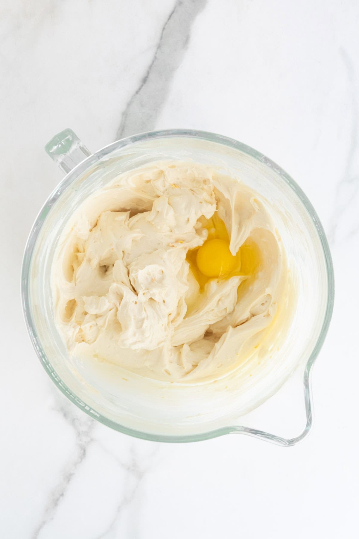One egg added to the cream cheese mixture before mixing
