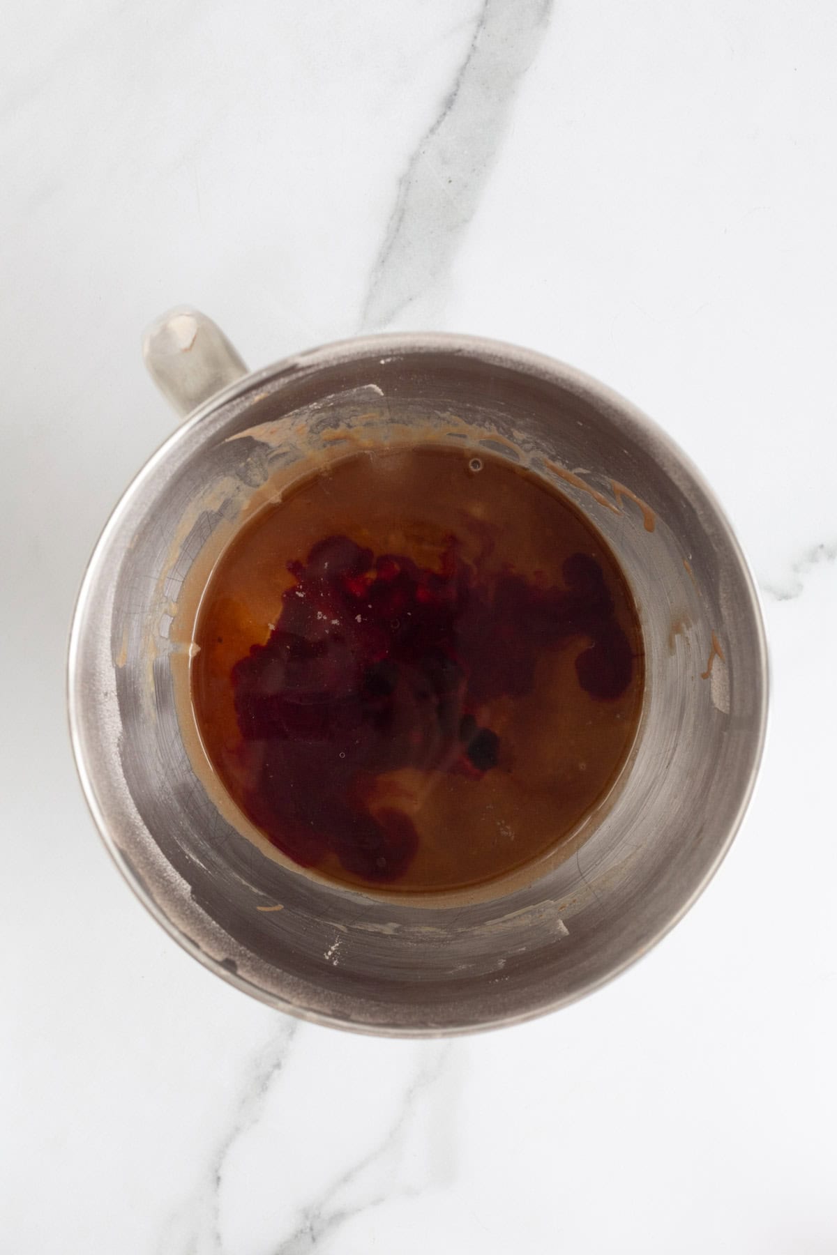 Red food coloring added to the wet chocolate mixture before mixing