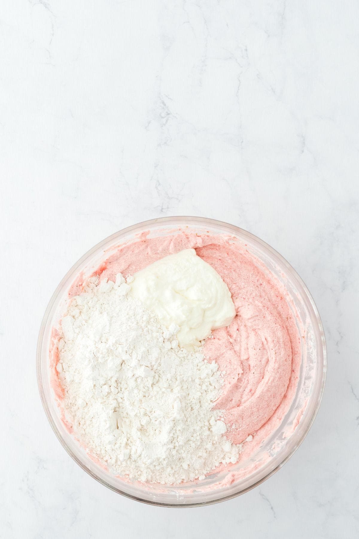 Strawberry batter with dry ingredients and sour cream added before mixing