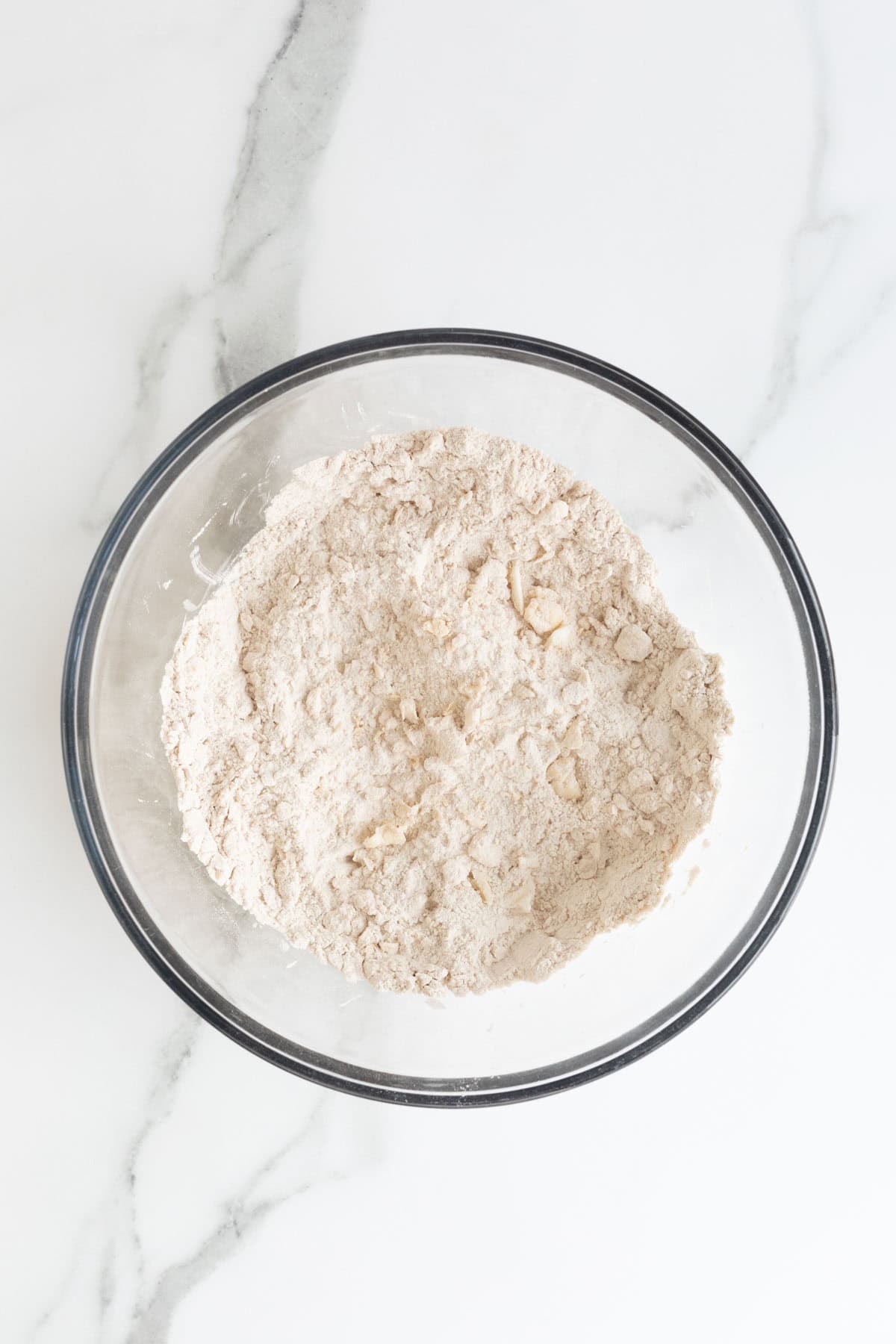 Dry ingredients with fat cut in, forming a coarse, crumbly texture