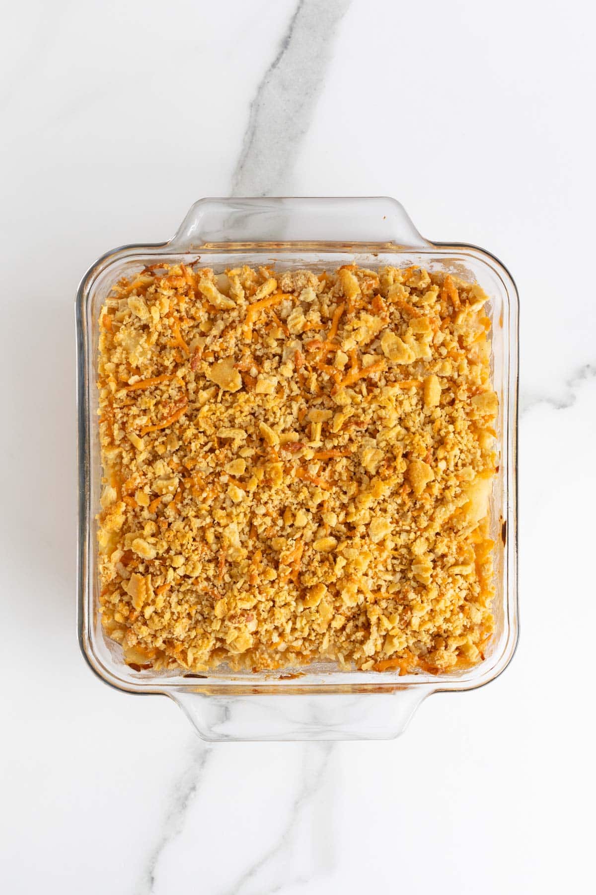 Baked pineapple casserole with a golden-brown, crispy topping