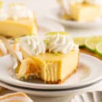 A slice of key lime pie on a plate with a fork.