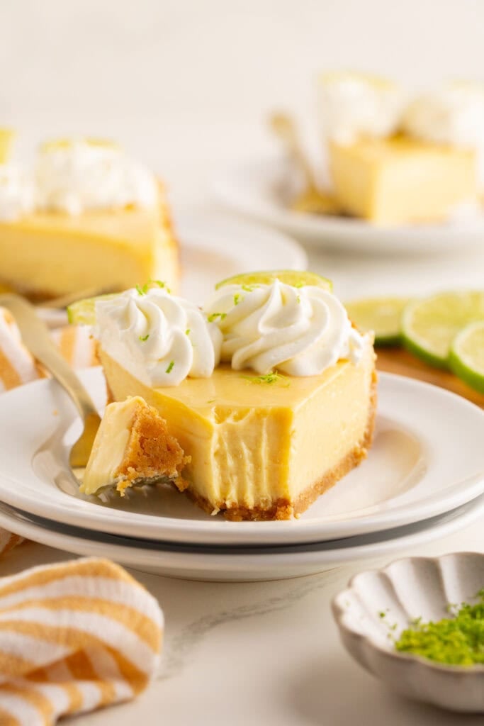 A slice of key lime pie on a plate with a fork.