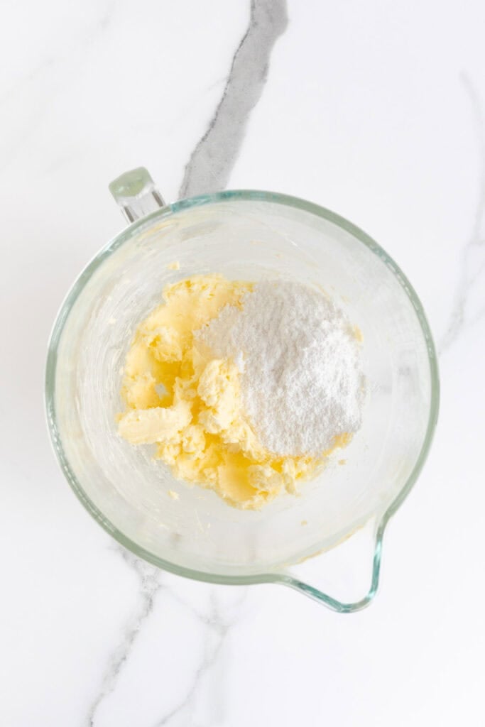 Butter and powdered sugar in a mixing bowl