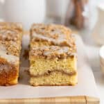 Close up of slices of coffee cake recipe on white parchment paper