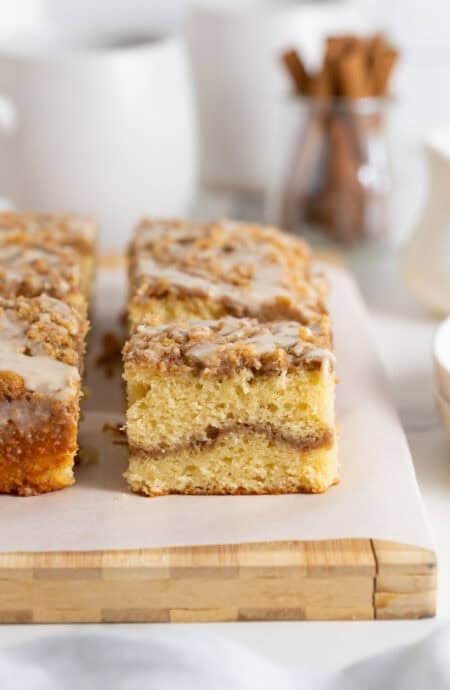 Close up of slices of coffee cake recipe on white parchment paper
