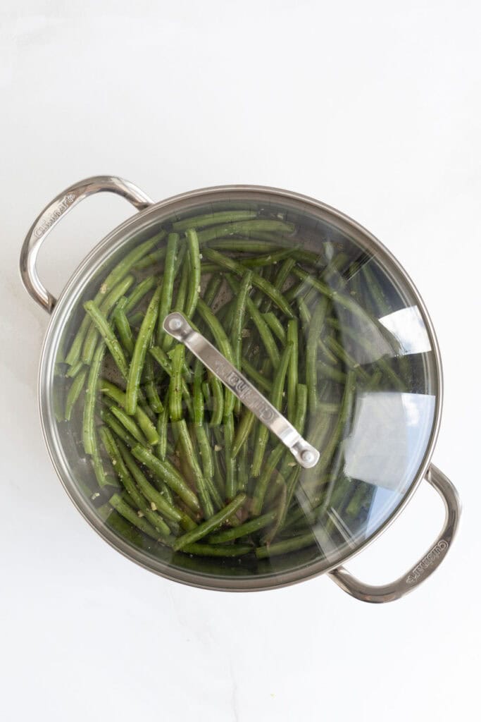 Lid on garlic green beans steaming
