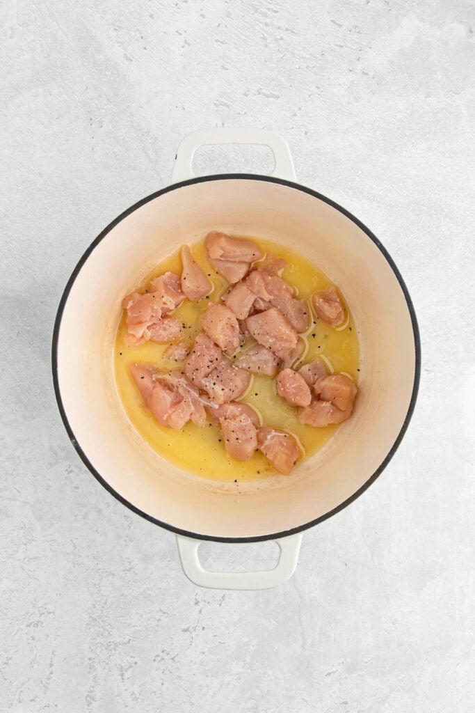 Chicken pieces seasoned in a pot