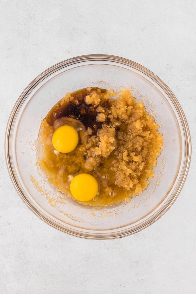 Eggs and vanilla in a bowl for making cookie batter