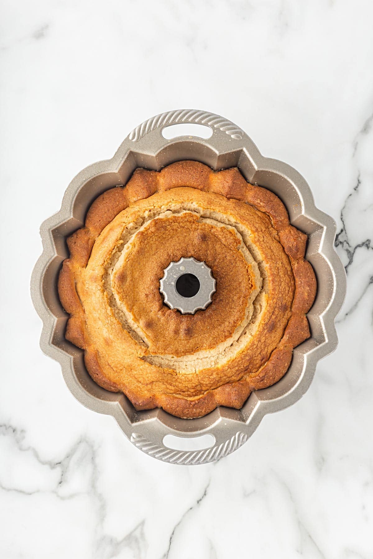 Freshly baked churro pound cake still in the Bundt pan