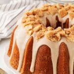 A glazed sweet potato pie pound cake topped with pie crust crumbles