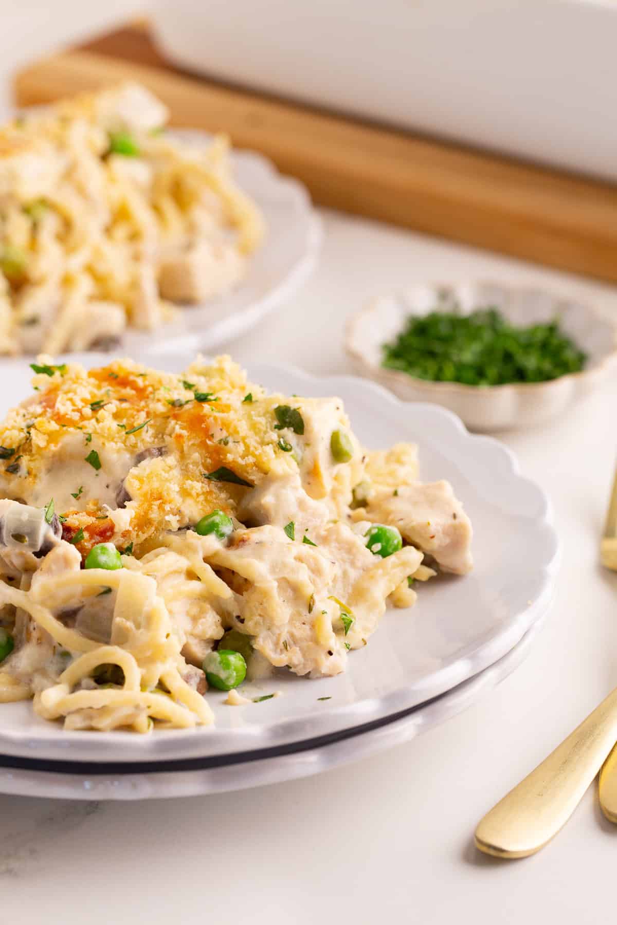 Closeup of a plate of turkey tetrazzini highlighting the creamy noodles and golden breadcrumb topping
