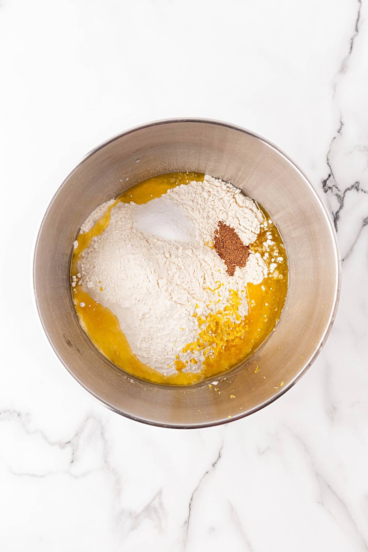 Dry ingredients and wet ingredients combined in a mixing bowl