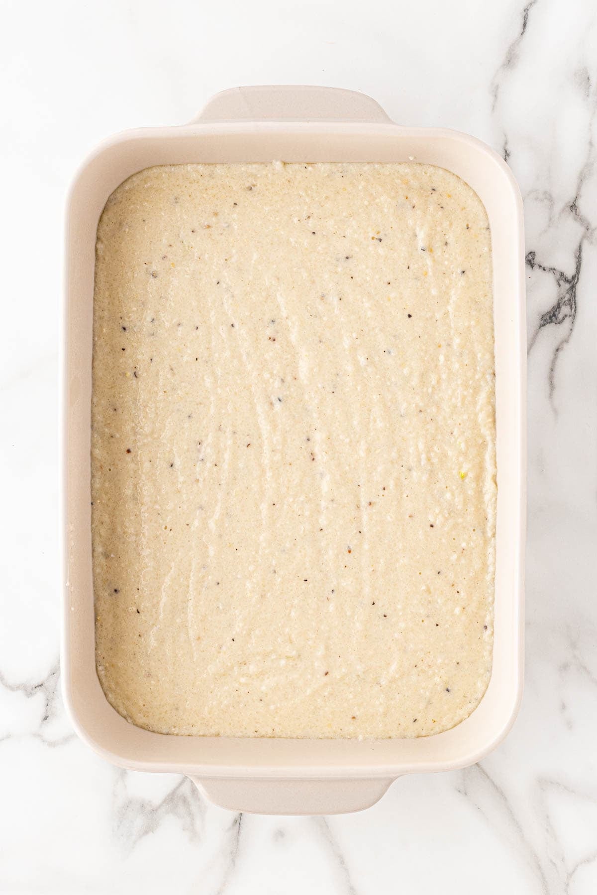 Grit mixture spread evenly in a baking dish